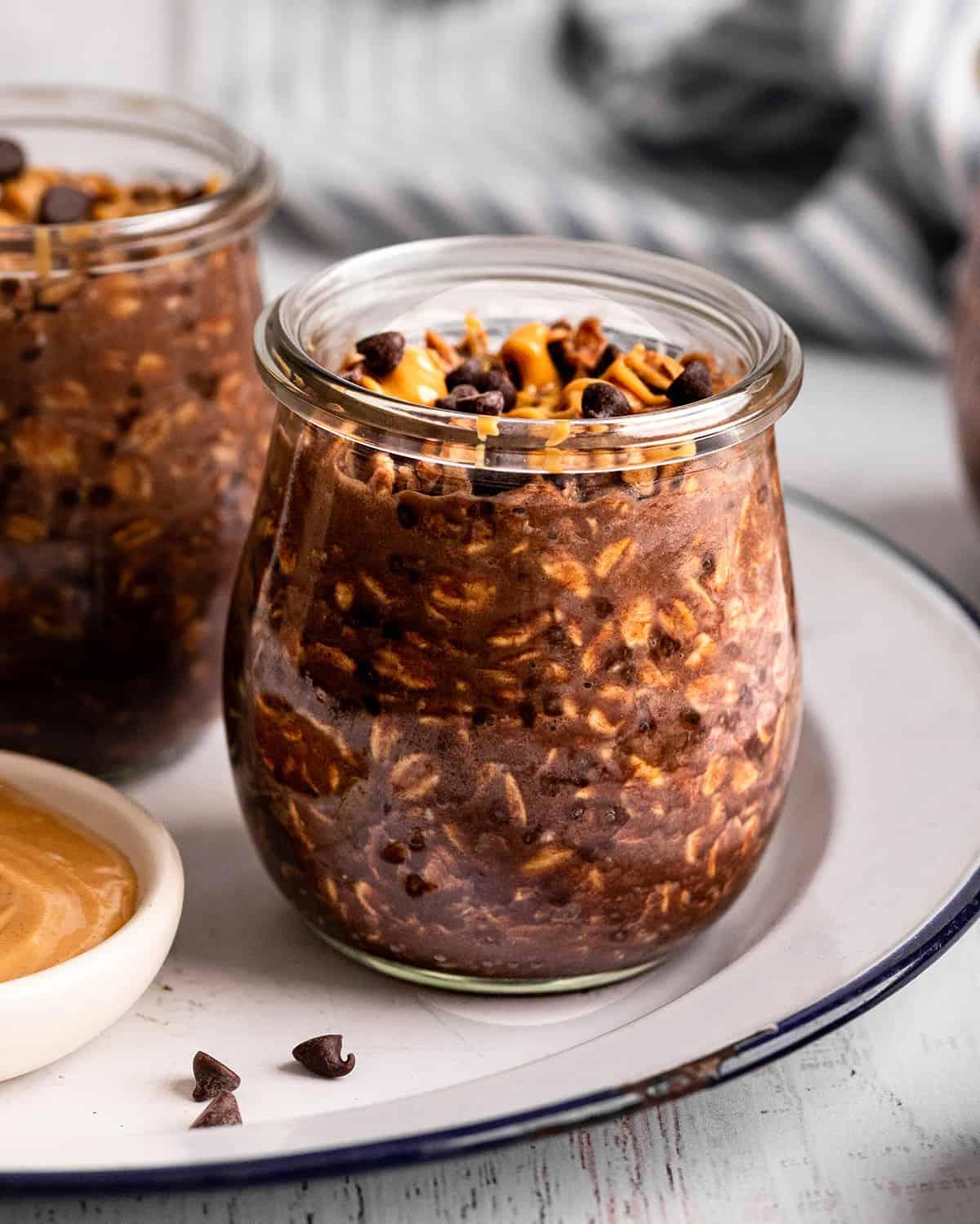 a glass jar of Chocolate Peanut Butter Overnight Oats