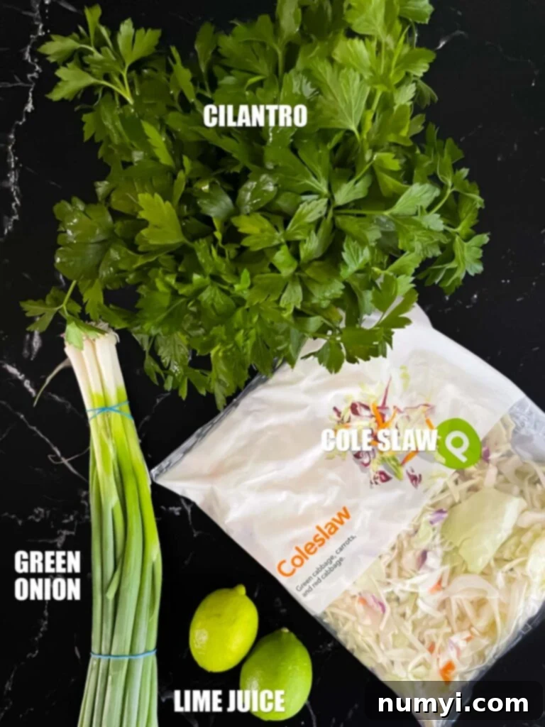 Crisp cabbage, cilantro, and green onions for the refreshing fish taco slaw.