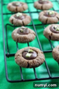 Delicious Mint Chocolate Thumbprint Cookies garnished with Andes mint chips