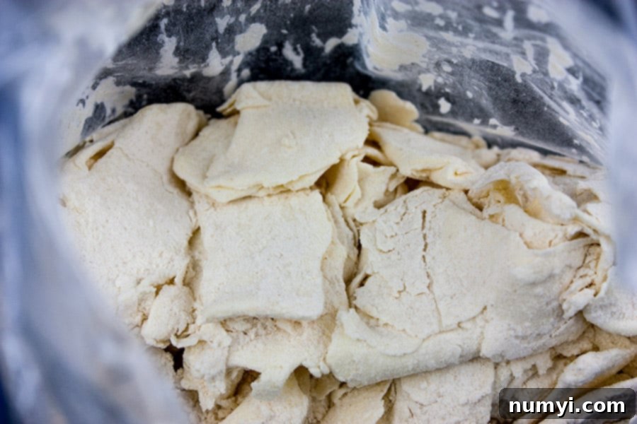 Sticky Buns 3 Morning bun dough rolled out and folded inside a large zip-top bag with visible butter flakes