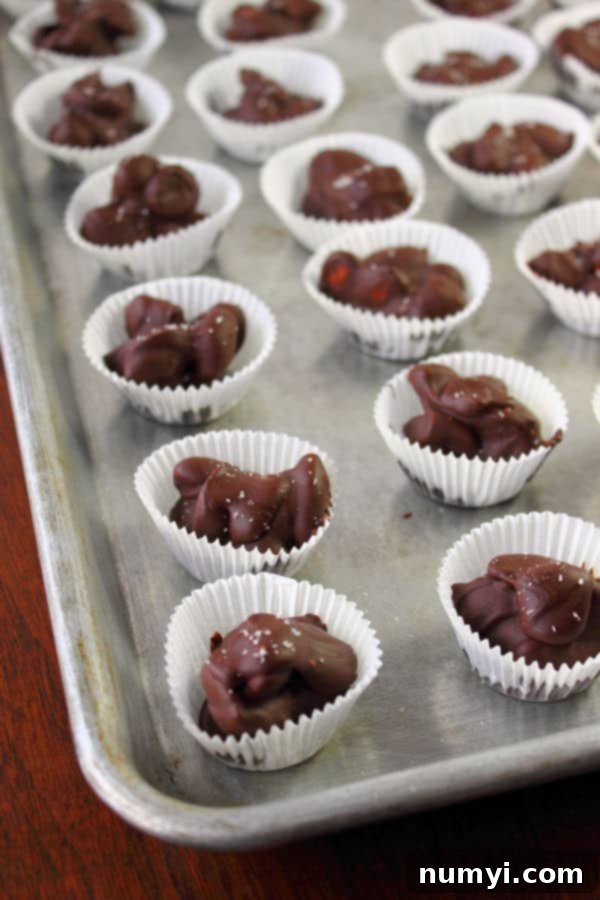 Cherry Almond Clusters in individual mini muffin liners laid out on a baking sheet