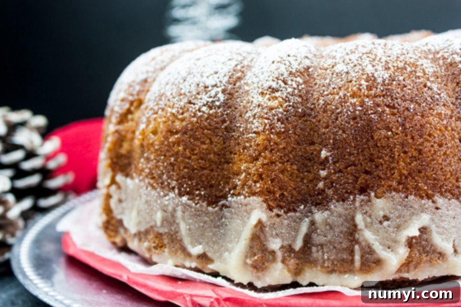 Spiced Eggnog Bundt with Creamy Glaze 7 Eggnog Bundt Cake on a cake serving dish.
