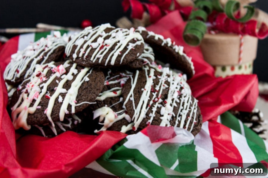 Double Chocolate Peppermint Cookies stacked in a tin, ready to be enjoyed.
