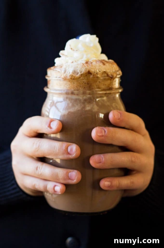 This Slow Cooker Creamy Pumpkin Hot Chocolate is rich, decadent and perfect for the holidays!!