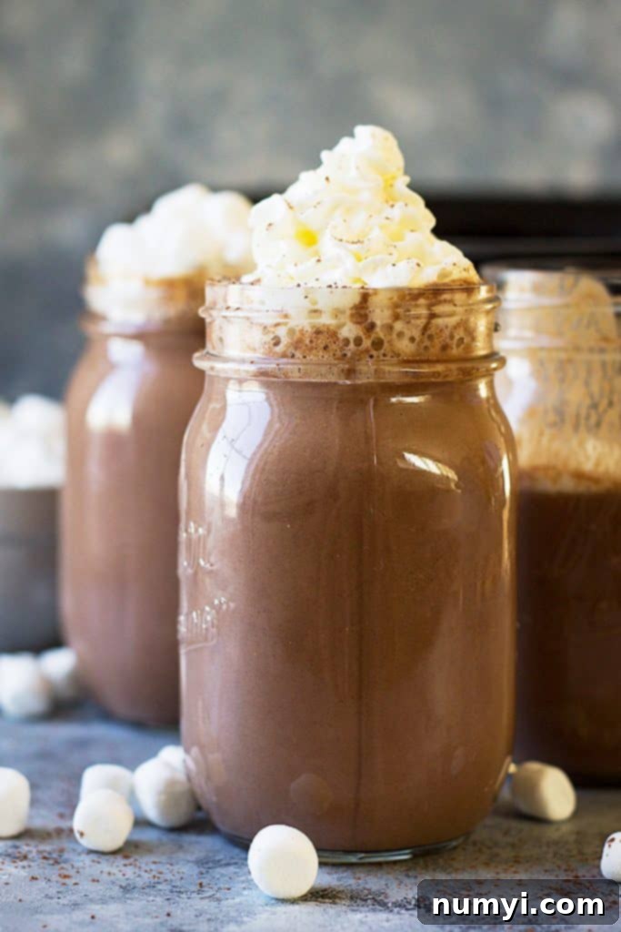 This Slow Cooker Creamy Pumpkin Hot Chocolate is a great way to warm up! It's rich, decadent and totally comforting!