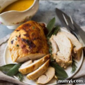 A perfectly cooked slow cooker turkey breast, ready to be carved, ideal for meal prepping or smaller gatherings.