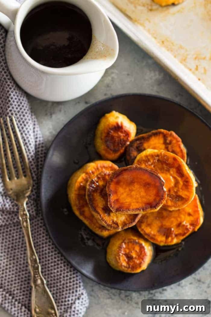 overhead: a stack of roasted sweet potatoes with cinnamon glaze on top