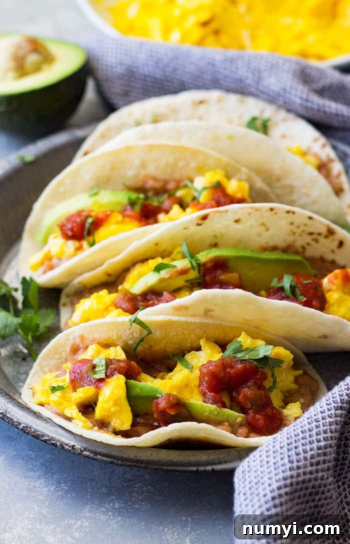 Sunrise Bean and Cheese Taco Bliss 4 Close up of bean and cheese breakfast tacos.