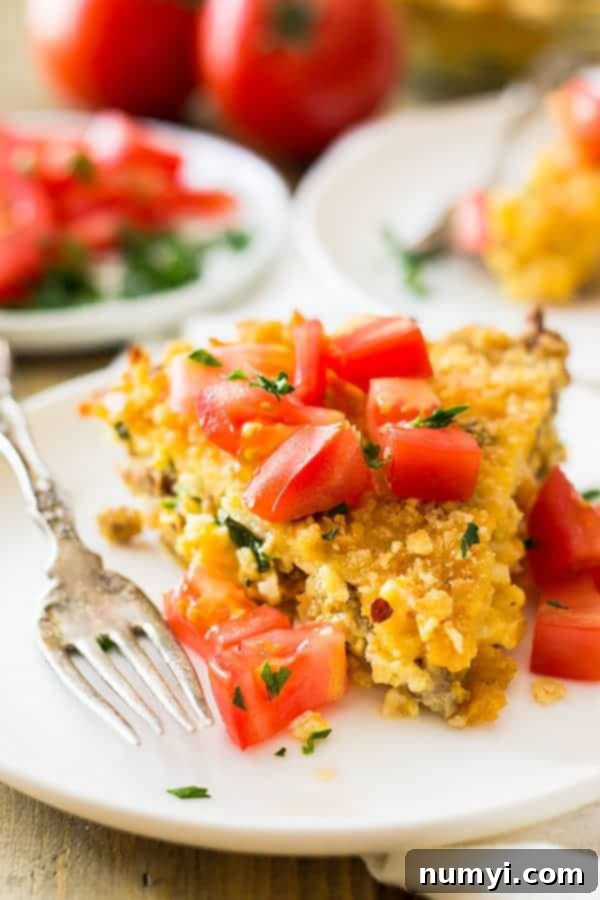 This Hashbrown Sausage Breakfast Pie is filled to the top with breakfast sausage, hashbrowns, 2 cheeses, garlic and a special topping! | www.countrysidecravings.com