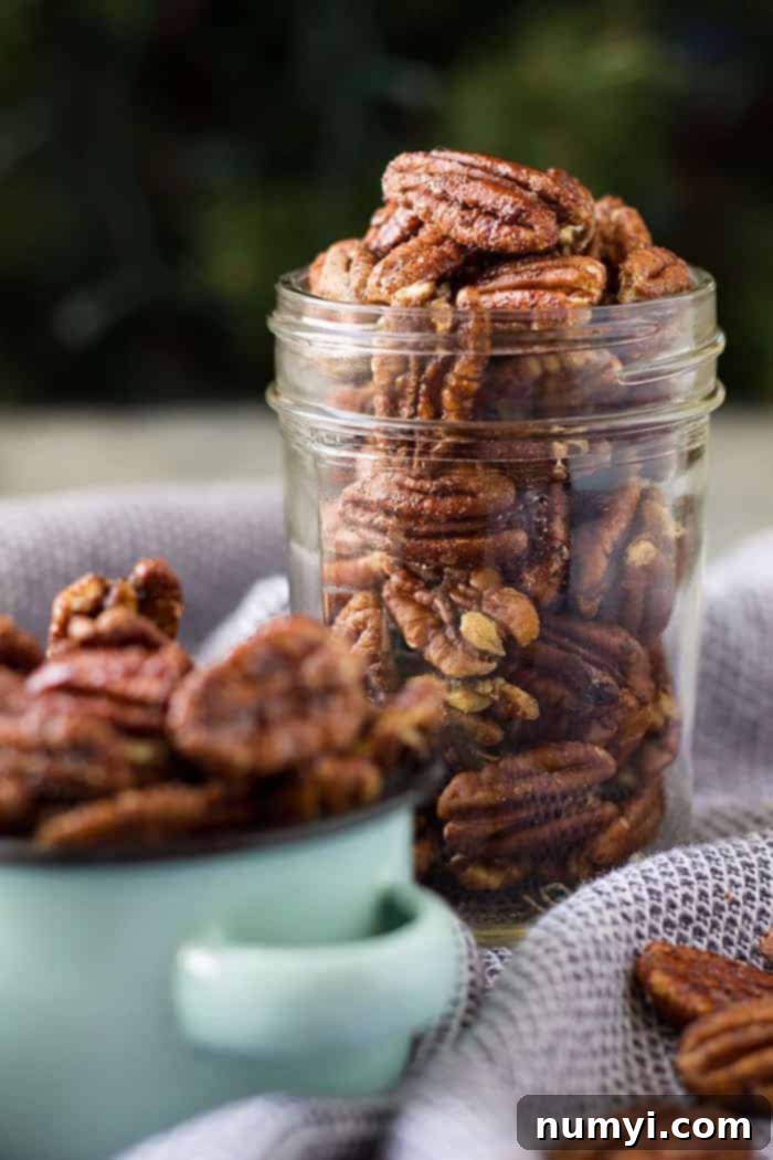 Spiced pecans beautifully arranged in a glass jar, ready for gifting or storage.