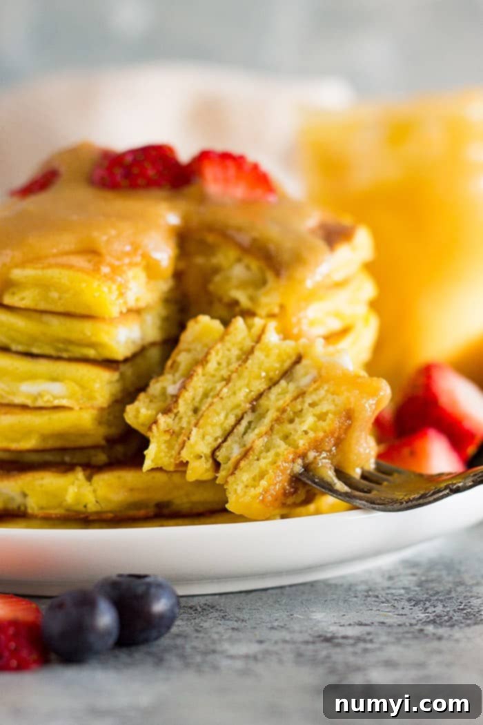 A bite of high protein cottage cheese pancakes on a fork.