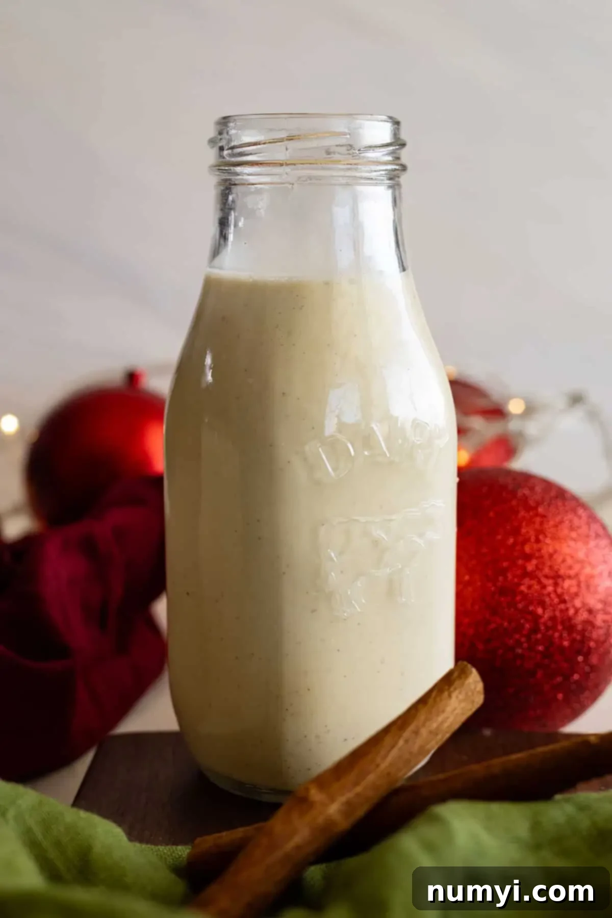 Creamy Homemade Eggnog 5 A tall jar of homemade eggnog ready to serve.