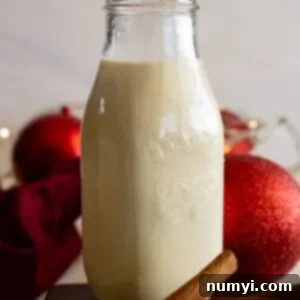 Creamy Homemade Eggnog 7 A tall jar of homemade eggnog ready to serve.