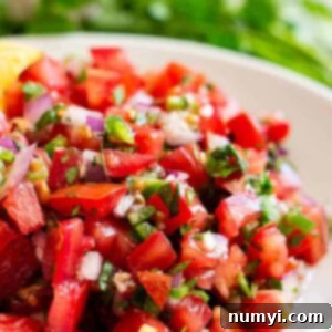 Close up view of Homemade Pico de Gallo in a bowl.
