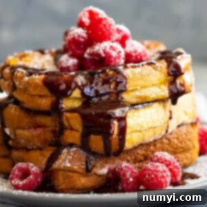Dreamy Raspberry Cheesecake French Toast 6 Raspberry Cheesecake Stuffed French Toast -is a very special brunch or breakfast! Buttery brioche bread stuffed with raspberry cheesecake filling then drizzled with hot fudge sauce! It's like dessert for breakfast!