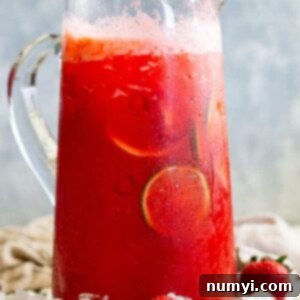 A pitcher of strawberry lemonade margarita