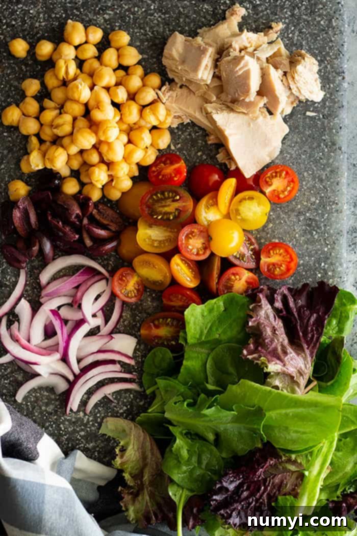 Close-up of a refreshing Quick Tuscan Tuna Salad, highlighting the crisp greens, flaked tuna, and colorful vegetables. This no-mayo, healthy recipe is perfect for busy schedules.