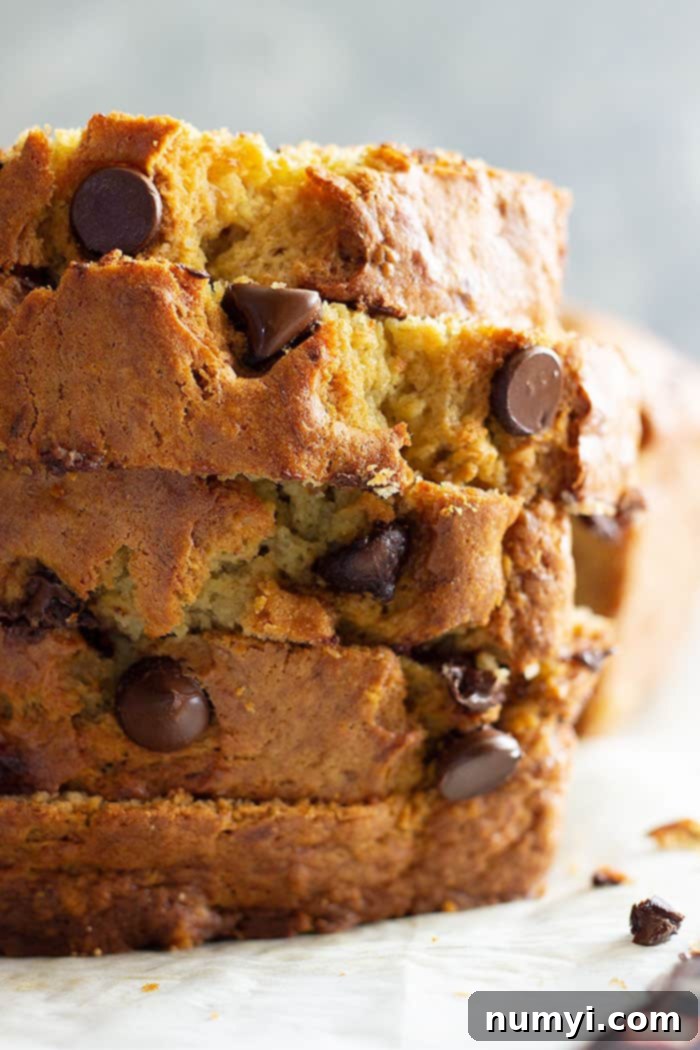 This Easy Banana Bread is a treasured family favorite! It's the BEST banana bread and it's perfect with additions like chocolate chips! #easyrecipe #bananabread #quickbread