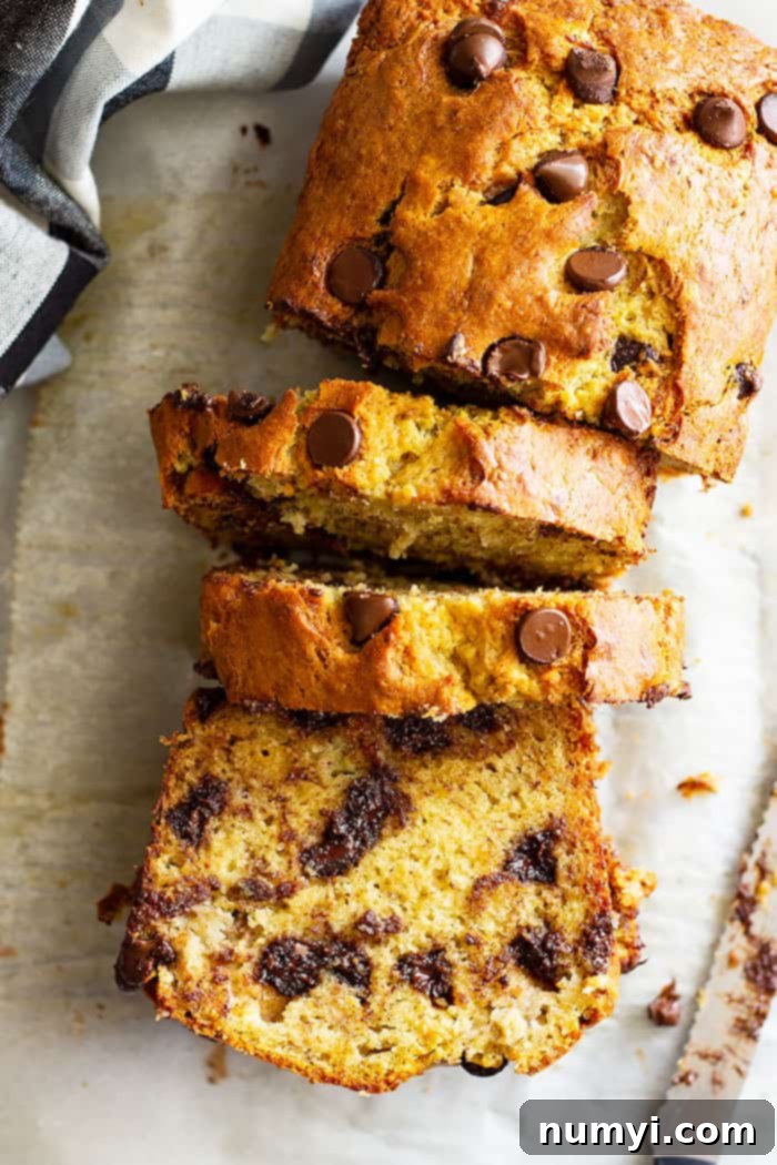 This Easy Banana Bread is perfectly moist, not gummy, and will become a family favorite I GUARANTEE it! It's perfect as is or throw in some chocolate chips or nuts to make it your own! #easyrecipe #bananabread #quickbread
