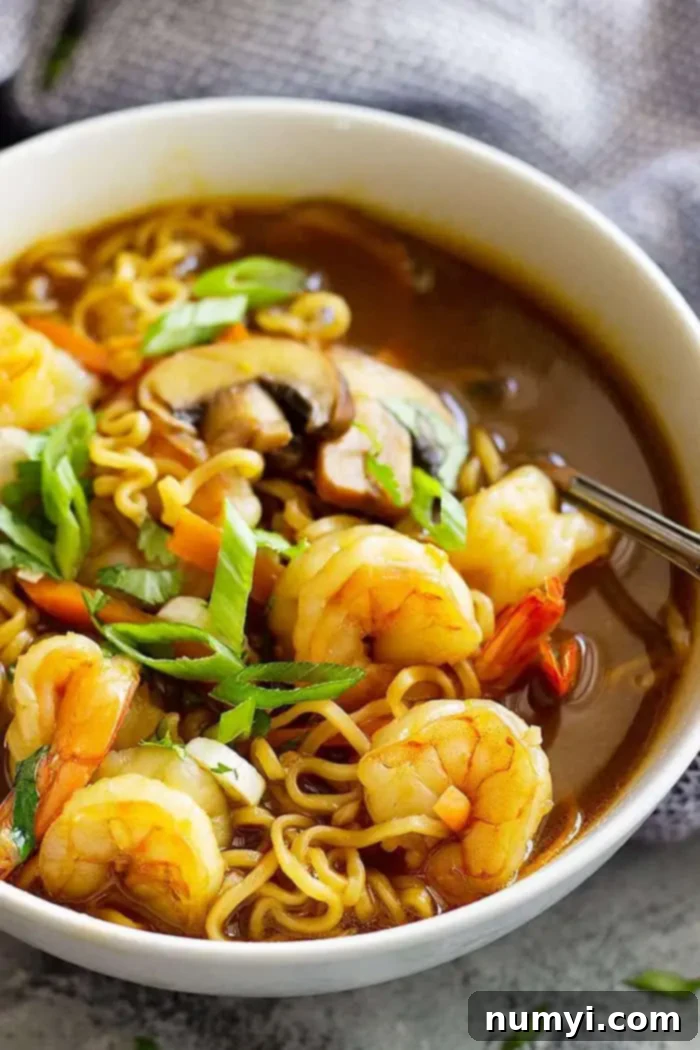 close up of ramen soup recipe in a bowl garnished with green onions