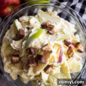 This Snicker Apple Salad is a super easy dessert salad that's great to take to potlucks, picnics, and family gatherings! It's guaranteed to be the first to go! #apple #easyrecipe #dessert #coolwhip