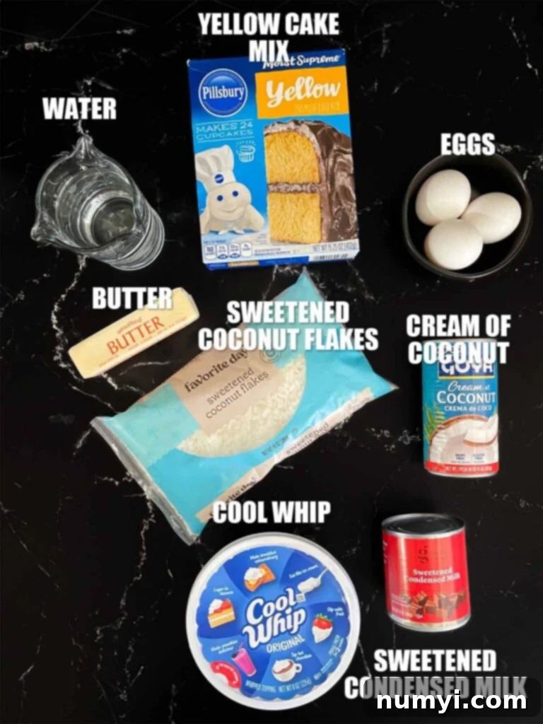 Various ingredients for the Easy Coconut Sheet Cake recipe are neatly arranged on a dark countertop, ready for preparation.