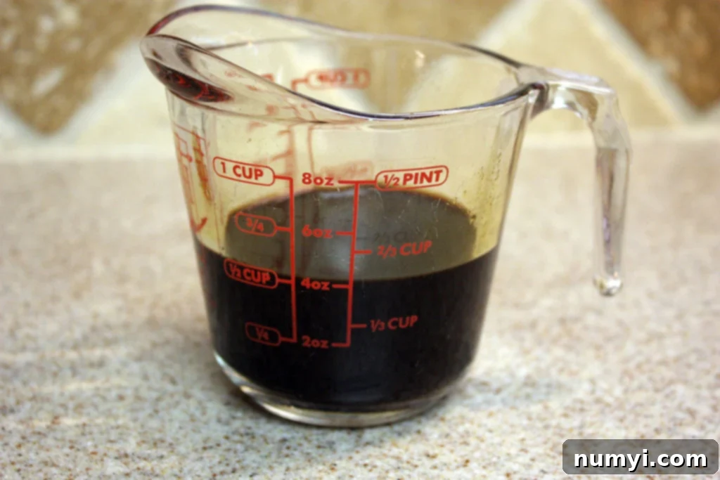 Espresso in a glass measuring cup.