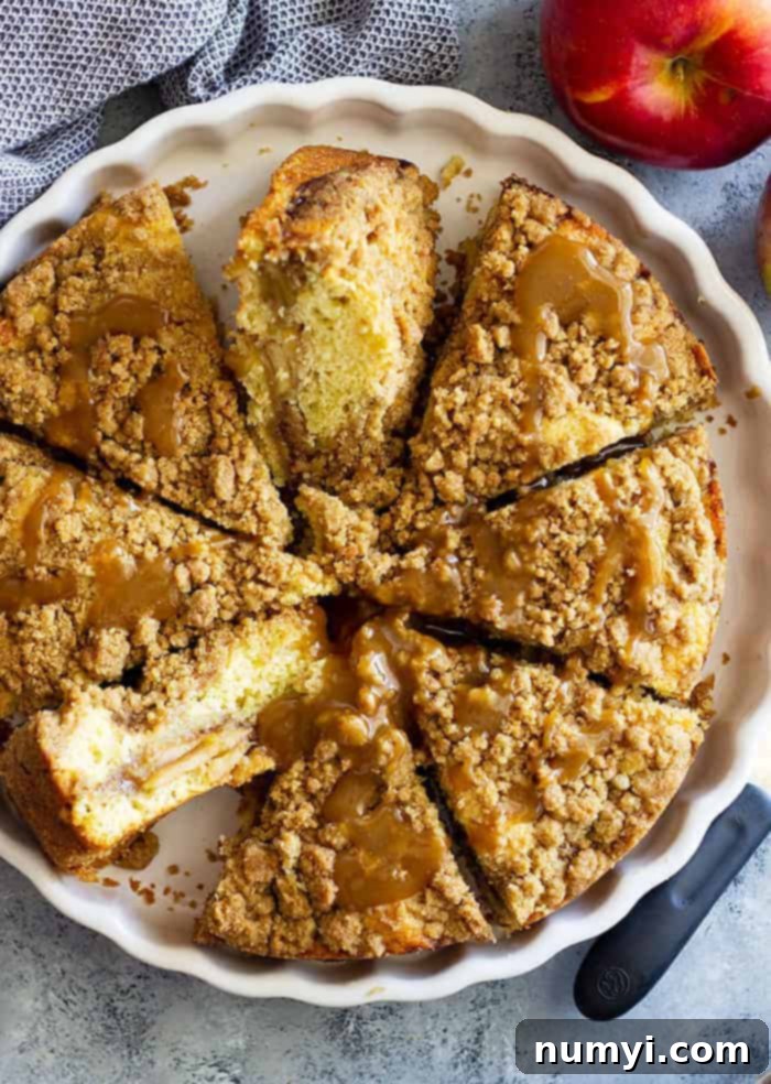 overhead: caramel apple crumb cake cut into slices in its baking dish