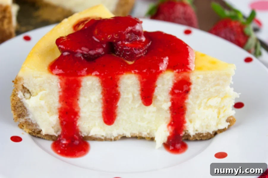 Smooth and Creamy Cheesecake with a strawberry topping.