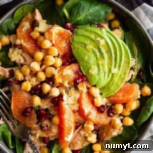This Spinach Salad with Salmon and Avocado is hearty, satisfying, and easy to make! Plus, it's a great healthy choice to take to work!! #spinachsalad #winterspinachsalad