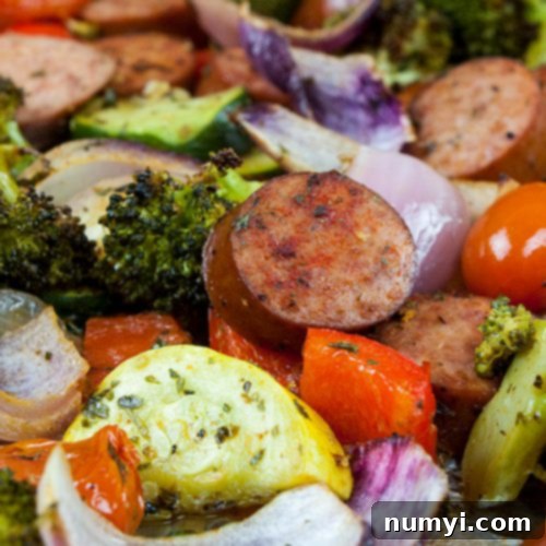 Sheet Pan Sausage and Vegetables mixed together, beautifully roasted.