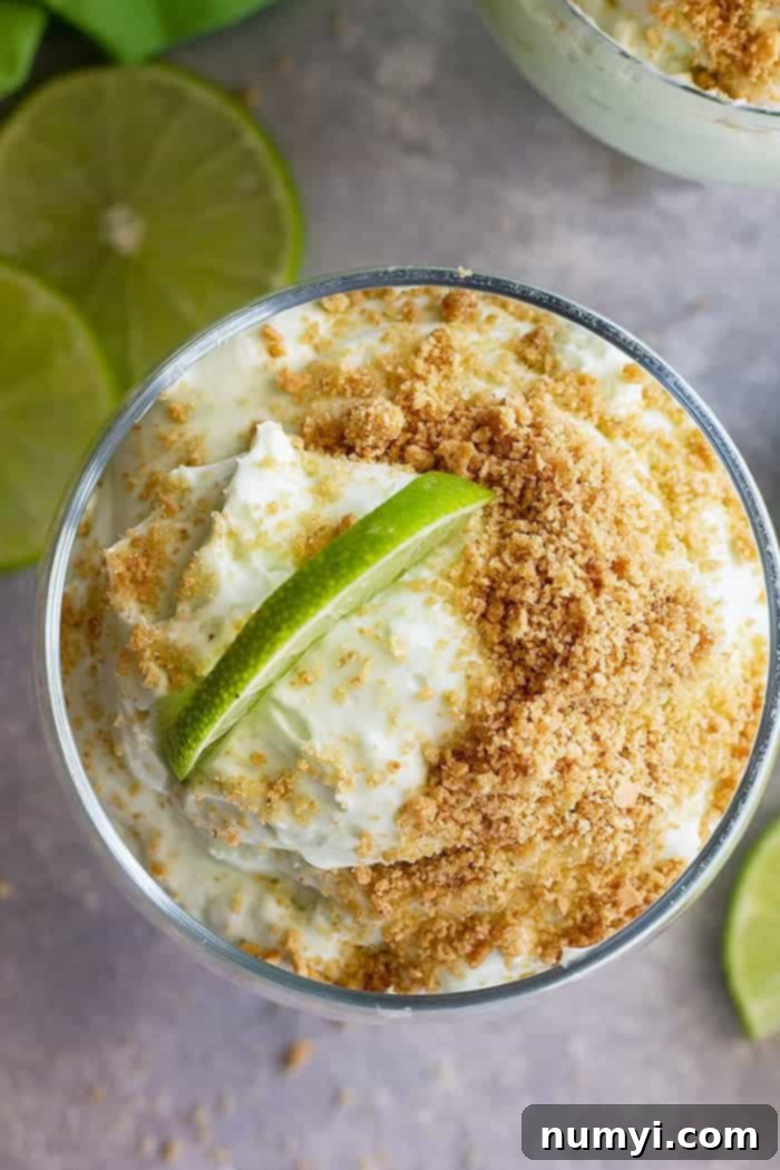 Zesty Lime Cheesecake Cloud 5 A top down view of lime cheesecake fluff in a dessert bowl.