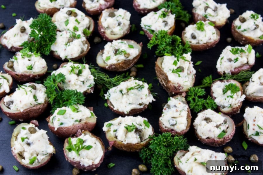 Platter of Deviled Potato Bites garnished with fresh parsley and dill, ready to be served as an elegant appetizer or side.