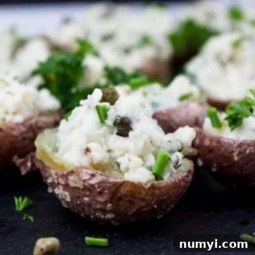 Perfectly presented Deviled Potato Bites with a chive garnish, ideal for any party.