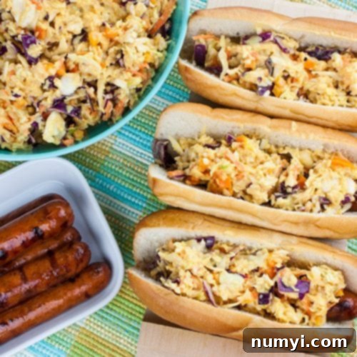 Hot Dogs with Mustard Slaw - Great for barbecues but also for a quick weeknight dinner! Our tangy southern mustard coleslaw brings the perfect amount of mustard tang to the average hot dog.