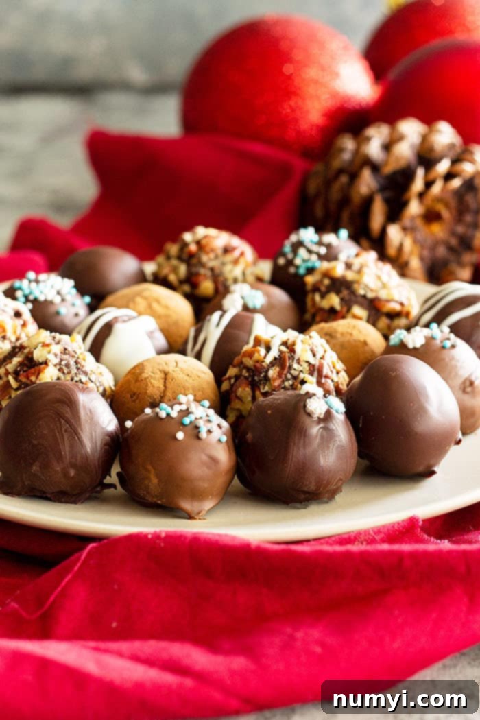 Platter of homemade dark chocolate truffles, some dusted with cocoa, others with sprinkles.
