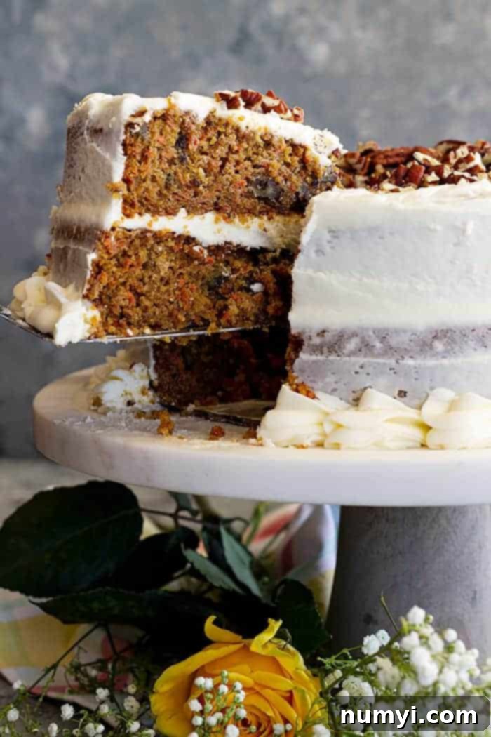 A large slice of cake being removed to be served. 