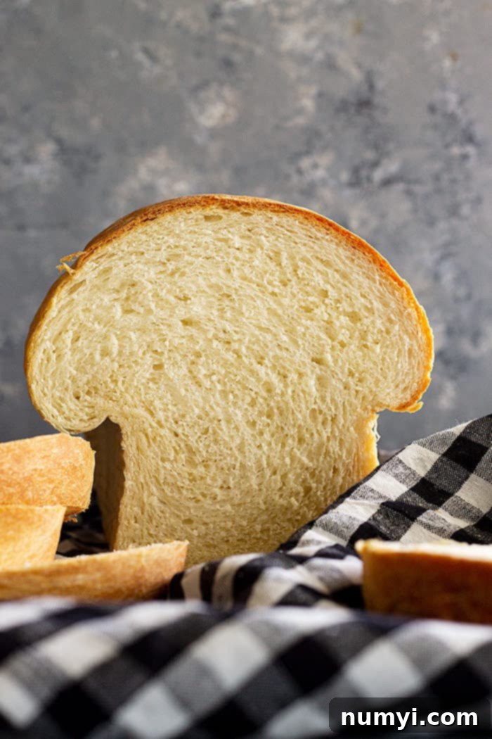 Loaf of bread that has been sliced into.