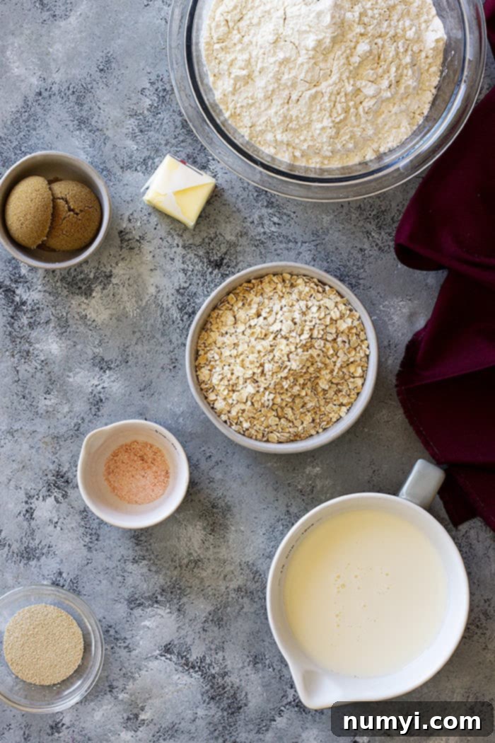 Ingredients for oatmeal sandwich bread laid out on a counter.