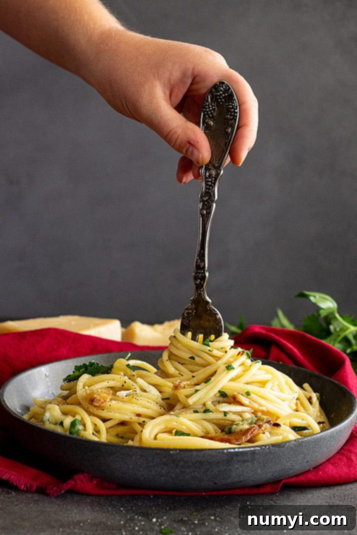 Garlic and Olive Oil Spaghetti 7 Twirling pasta onto a fork.