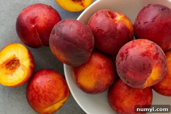 Overhead view of a bounty of fresh, ripe peaches, ready to be transformed into delicious homemade peach ice cream.