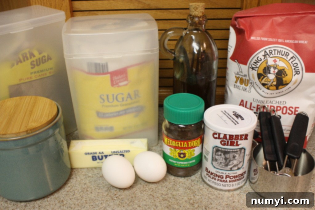 Espresso biscotti ingredients laid out on a light surface, ready for baking.