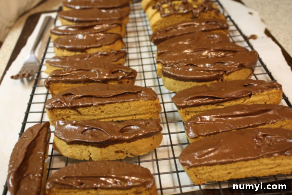 Chocolate dipped Espresso Biscotti cooling on a wire rack.