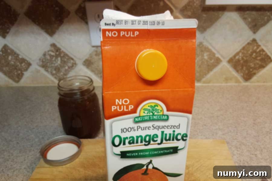 A simple orange juice carton, ready to be repurposed for a clever syrup storage hack.