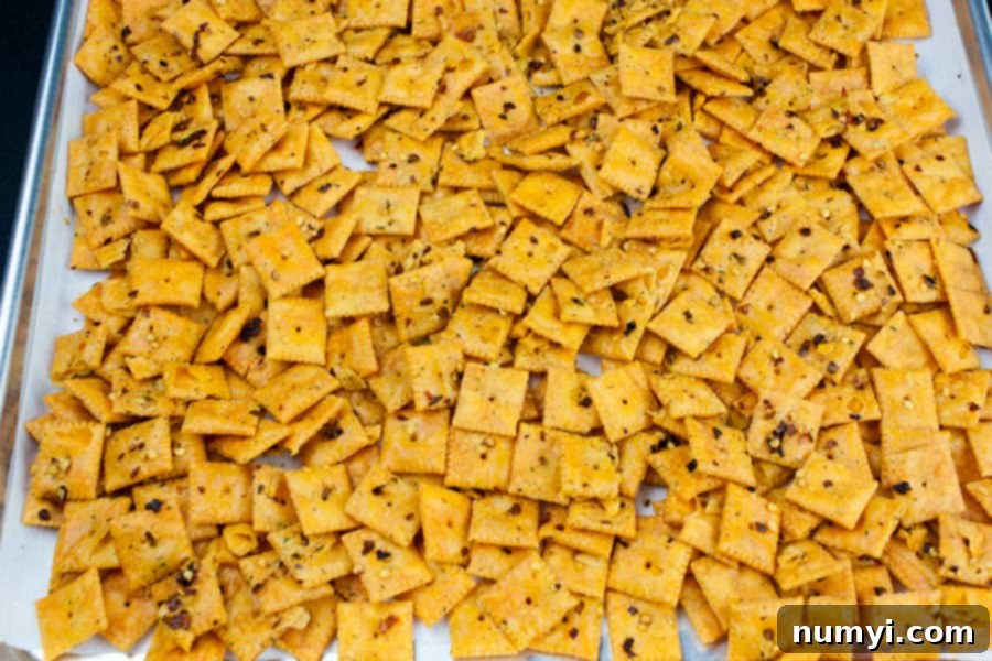 Exploding Cheese Bites 5 Firecracker Cheez-Itz - crackers on a parchment lined baking sheet