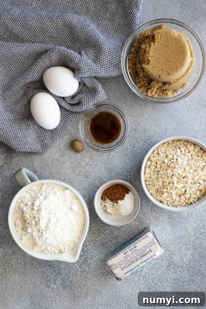 Hearty Spiced Oatmeal Cake 3 A curated selection of fresh ingredients neatly arranged on a countertop, ready to be transformed into a delicious Old Fashioned Oatmeal Cake. Includes oats, brown sugar, butter, eggs, vanilla, flour, baking soda, cinnamon, nutmeg, salt, and ingredients for the coconut topping.