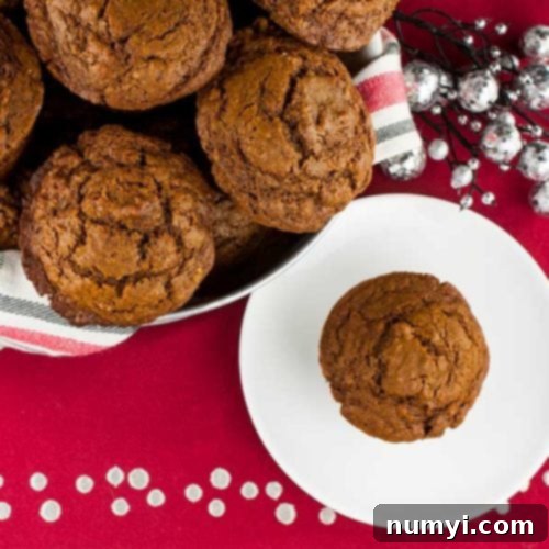 Spiced Molasses Muffins 8 Festive gingerbread muffins in a basket, embodying the spirit of holiday baking.