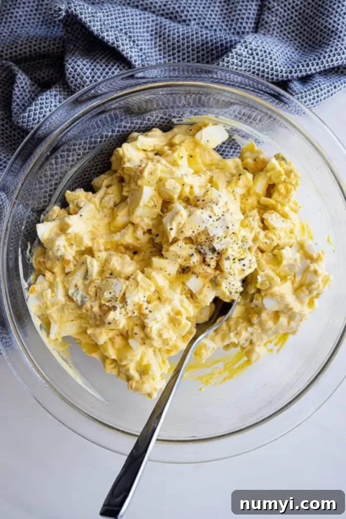 Irresistible Egg Salad 5 Overhead view of a large bowl of freshly made egg salad, perfectly mixed and ready to be used for sandwiches or served as a side dish.