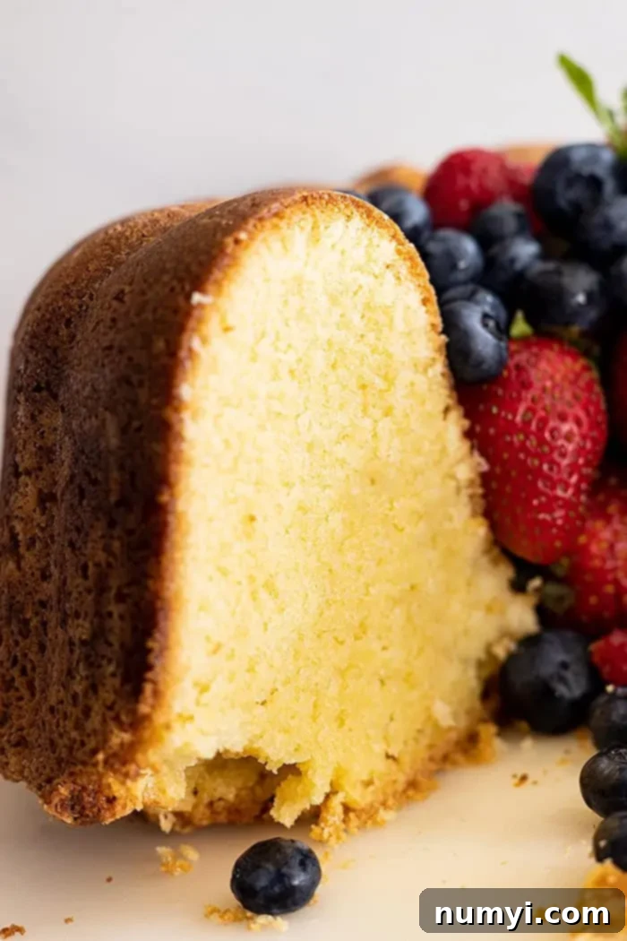 The Quintessential Pound Cake 7 A close-up view revealing the beautifully tight and moist interior crumb of the perfectly baked pound cake.