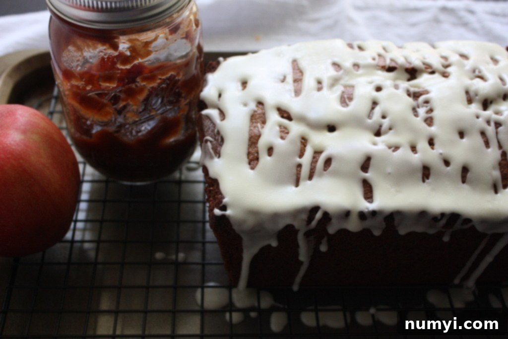Freshly baked Apple butter bread on a wire rack, ready to be sliced.